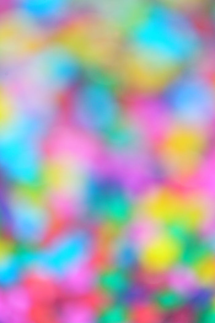 Colorful abstract background with blurred multicolor bokeh, perfect for creative design projects.